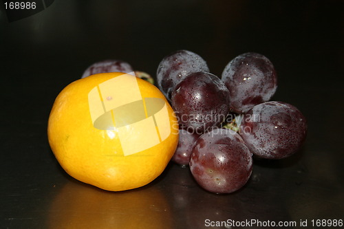 Image of Red grapes and orange