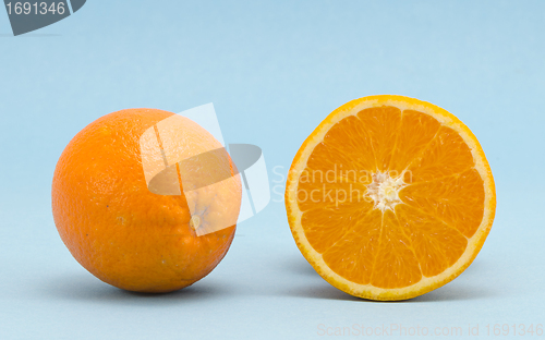 Image of Orange healthy nutrition fruits  blue background 