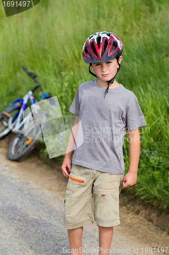 Image of portrait of boy bicyclist with helmet