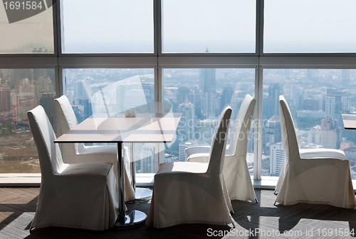 Image of empty desk in a skyscraper restaurant