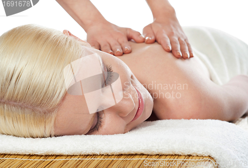 Image of Attractive young spa lady getting a massage