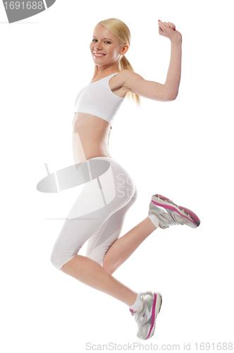 Image of Happy teenager jumping with excitement