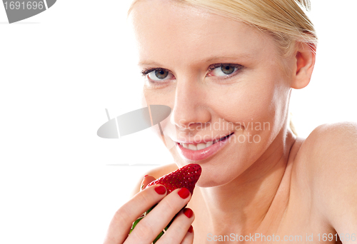 Image of Closeup of young gorgeous girl holding strawberry