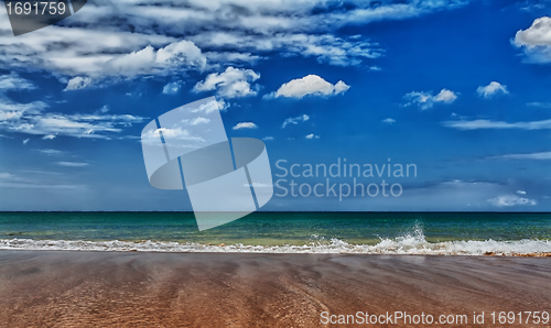 Image of A tropical beach with blue sea
