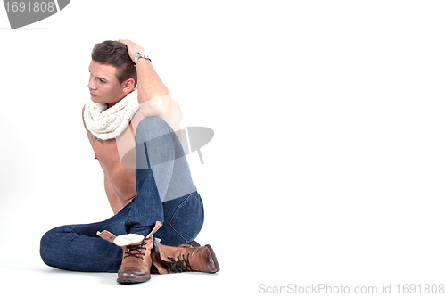 Image of young man with a muscular body and fashion