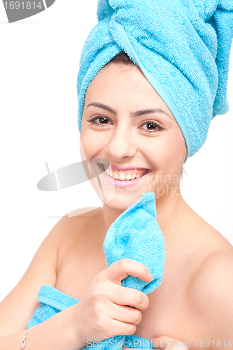 Image of young beautiful woman with a towel doing wellness