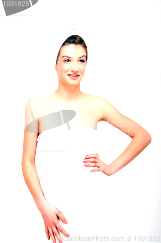 Image of young beautiful woman with a towel doing wellness