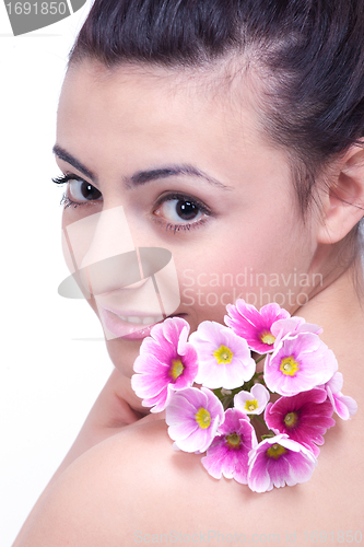 Image of young beautiful brunette woman with flower