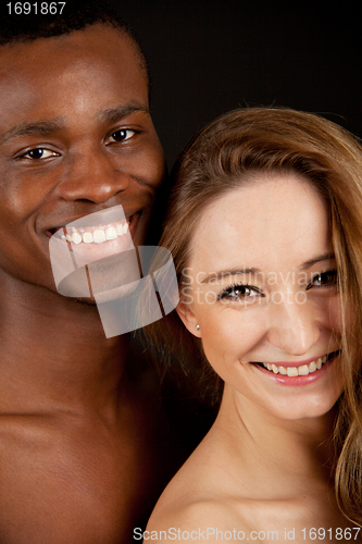 Image of young beautiful caucasian woman with a man with dark skin couple lovers