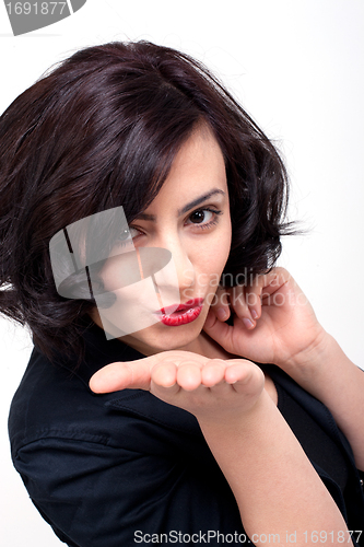 Image of beautiful young brunette woman kissing