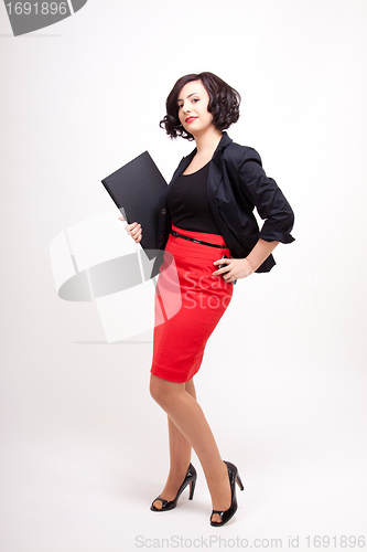 Image of young business woman with dark hair successful