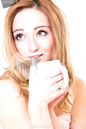 Image of young beautiful girl with a cup of coffee