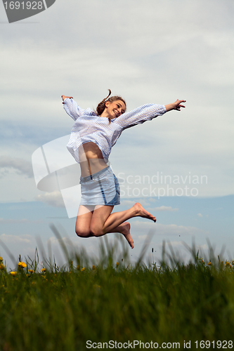 Image of young woman is happy outdoor in summer