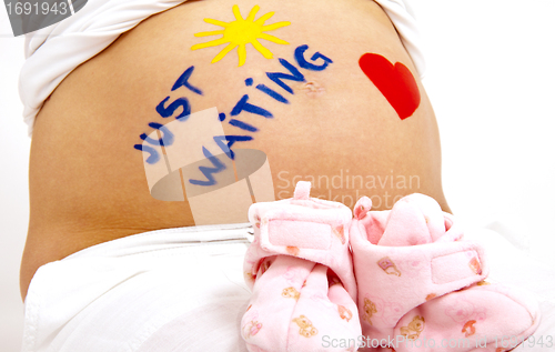 Image of older pregnant woman looks forward to her baby