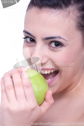 Image of beautiful young brunette girl with a green apple 