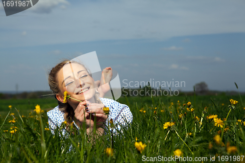 Image of smiling woman outdoor in summer 