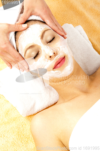 Image of young beautiful brunette woman doing wellness with massage
