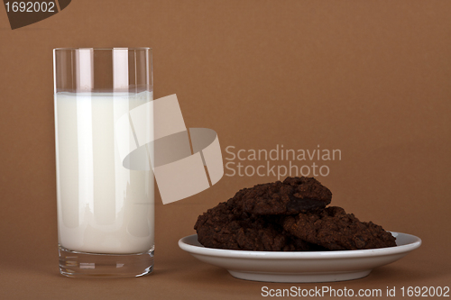 Image of chocolate cookies with a glass of milk