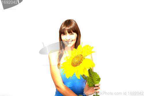 Image of young beautiful brunette woman with a flower happy