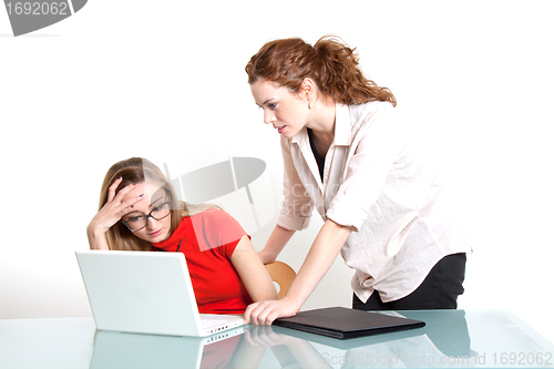 Image of two business woman are discussing about a problem at work