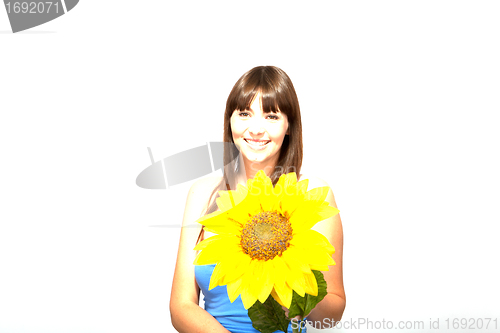 Image of young beautiful brunette woman with a flower happy