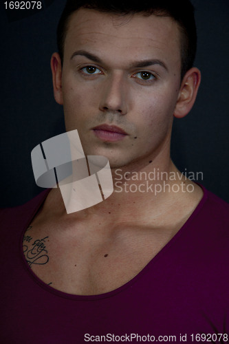 Image of young man with a muscular body and fashion