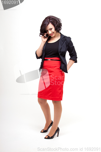 Image of young business woman is talking on the mobile phone