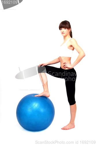 Image of young beuatiful woman is doing workout 