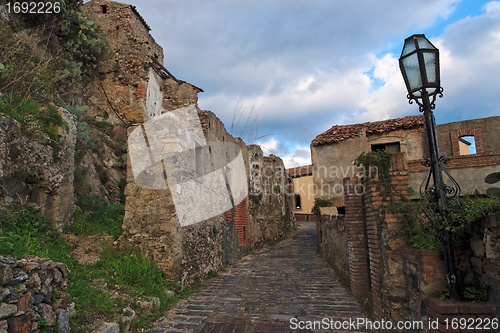 Image of Paved medieval street with ruined house in Savoca village, Sicily, Italy