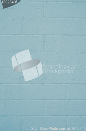 Image of Brick wall painted with a blue paint 