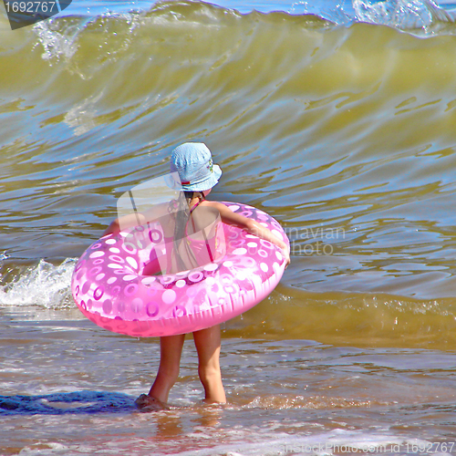 Image of little girl with an inflatable circle 