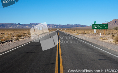 Image of long highway through desert