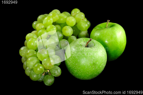 Image of Apples and grapes on  black background