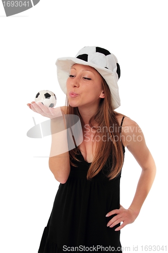 Image of Woman kissing a little football