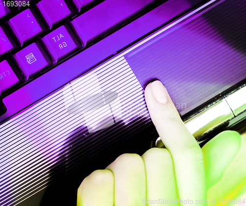Image of Working at laptop .