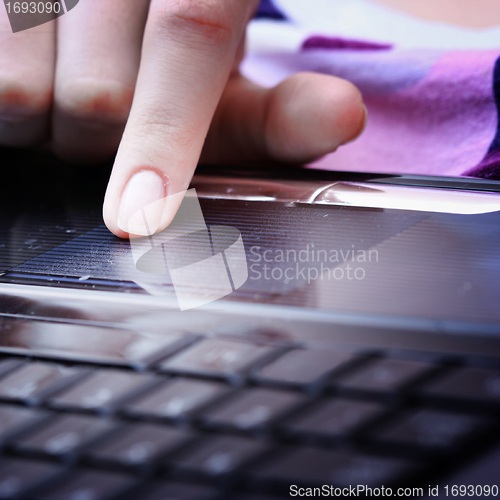 Image of Working at laptop .