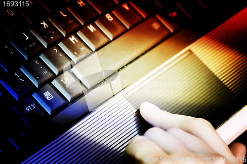 Image of Working at laptop .
