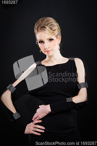 Image of beautiful woman in a fashionable black dress