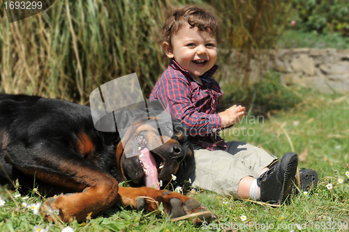 Image of rottweiler and child