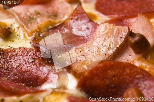 Image of Italian pizza with bacon, salami and mozzarella cheese