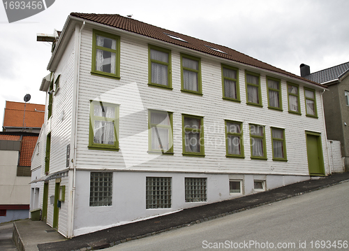 Image of single building on steep road