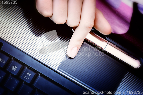 Image of Working at laptop .