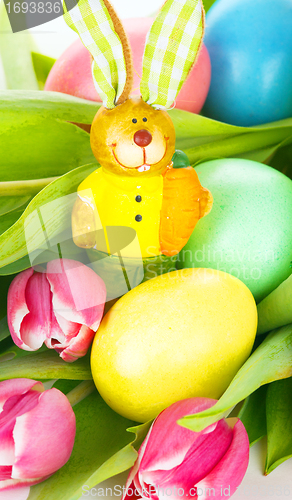 Image of tulip wit eastern eggs a rabbit and letters in different colours