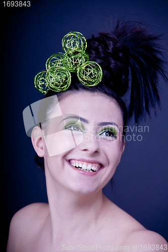 Image of portrait of a beautiful young brunette girl with a bright smile