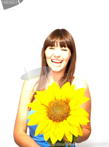 Image of young beautiful brunette woman with a flower happy