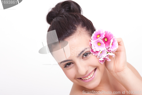 Image of young beautiful brunette woman with flower