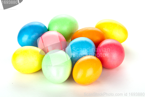 Image of eastern eggs in different colours in a basket with a rabbit