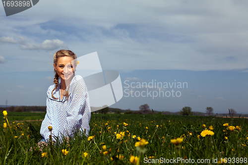 Image of smiling woman outdoor in summer 