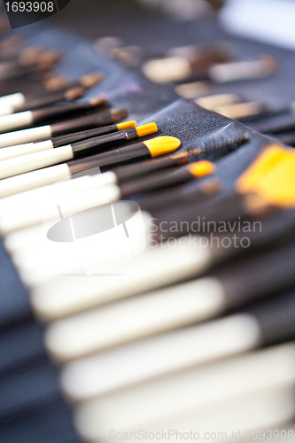 Image of make up brushes in a case closeup