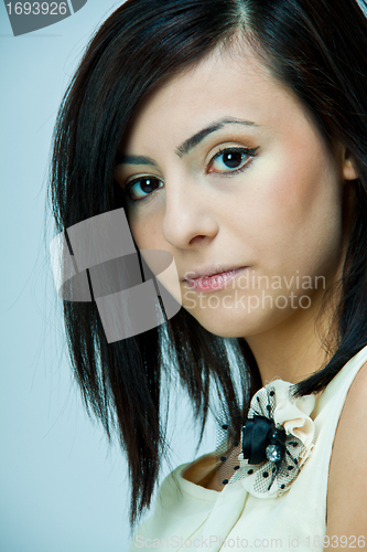 Image of portrait of a beautiful young brunette girl with a bright smile